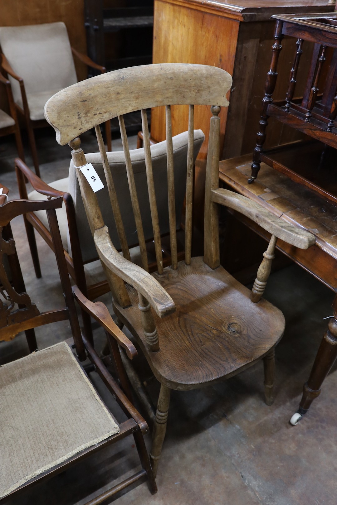 A Victorian elm and beech Windsor comb back armchair together with a late Victorian beech folding elbow chair